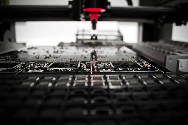 An automated machine working over a circuit board