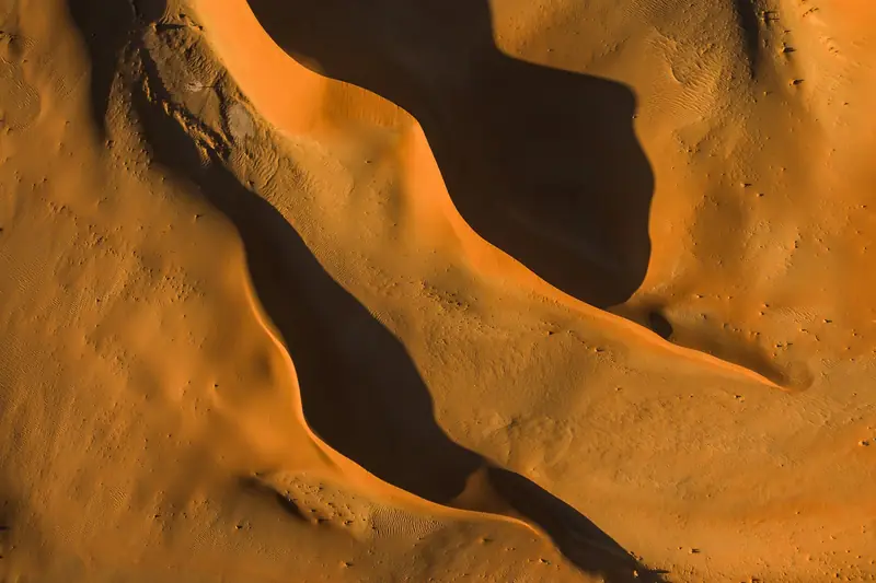 Aerial view of desert dunes in low light