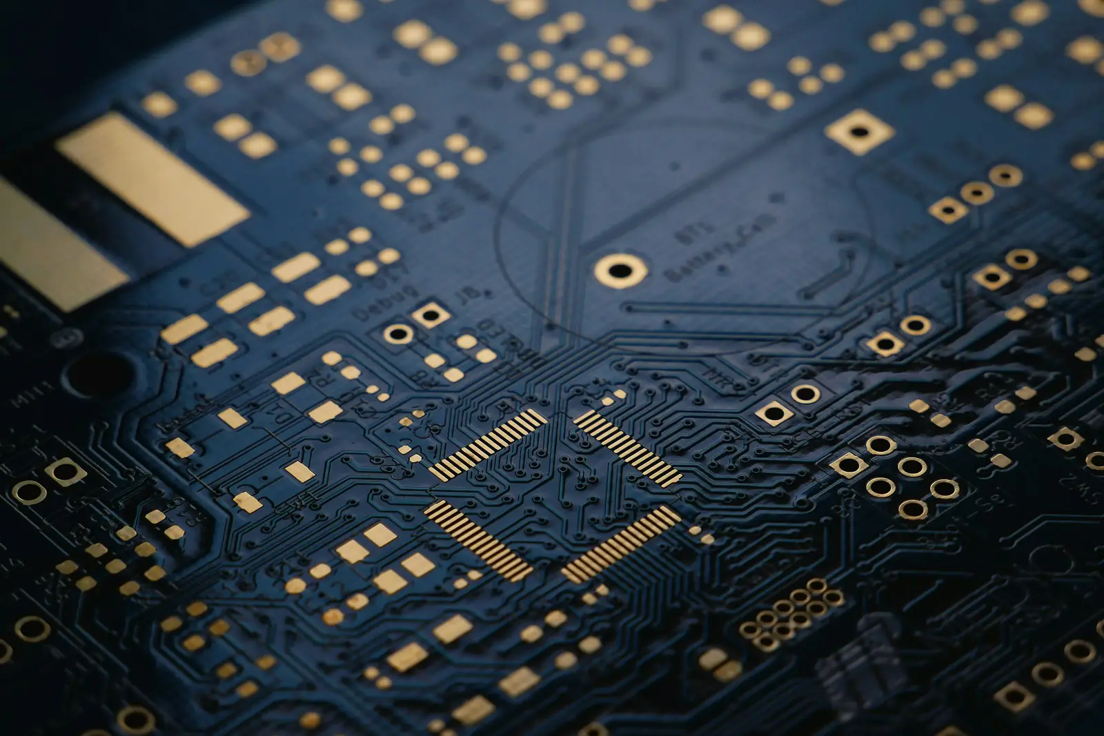 Close-up of a circuit board with gold contact pads